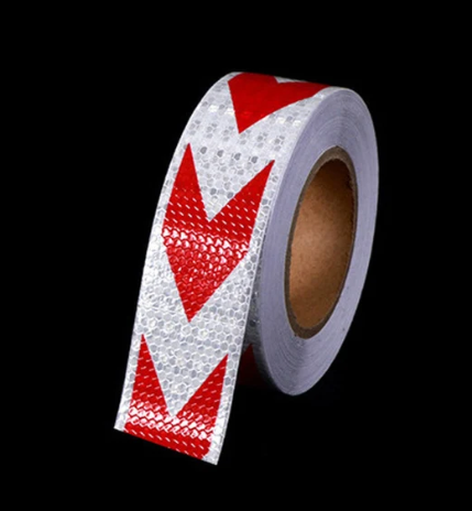 Red and white arrow pattern reflective tape roll